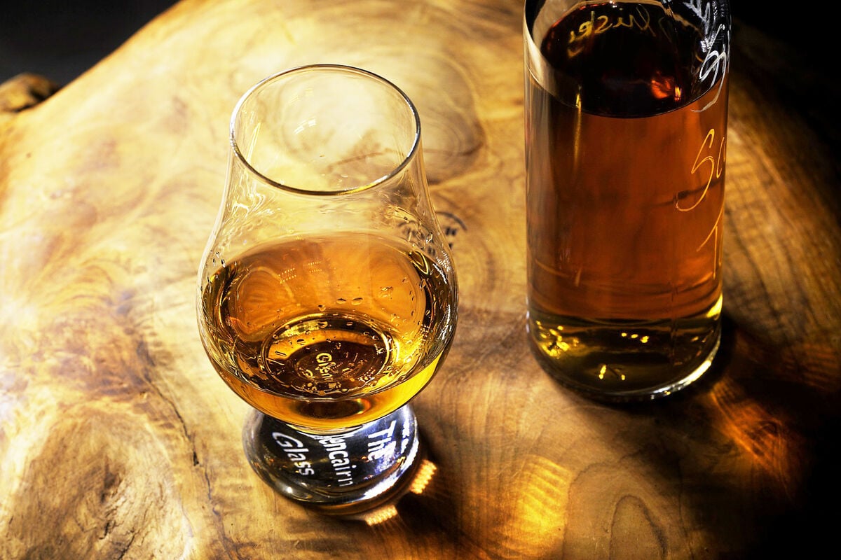 attractive whiskey glass on wooden table
