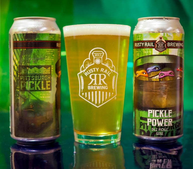 rusty rail brewing pickle power beer on green background