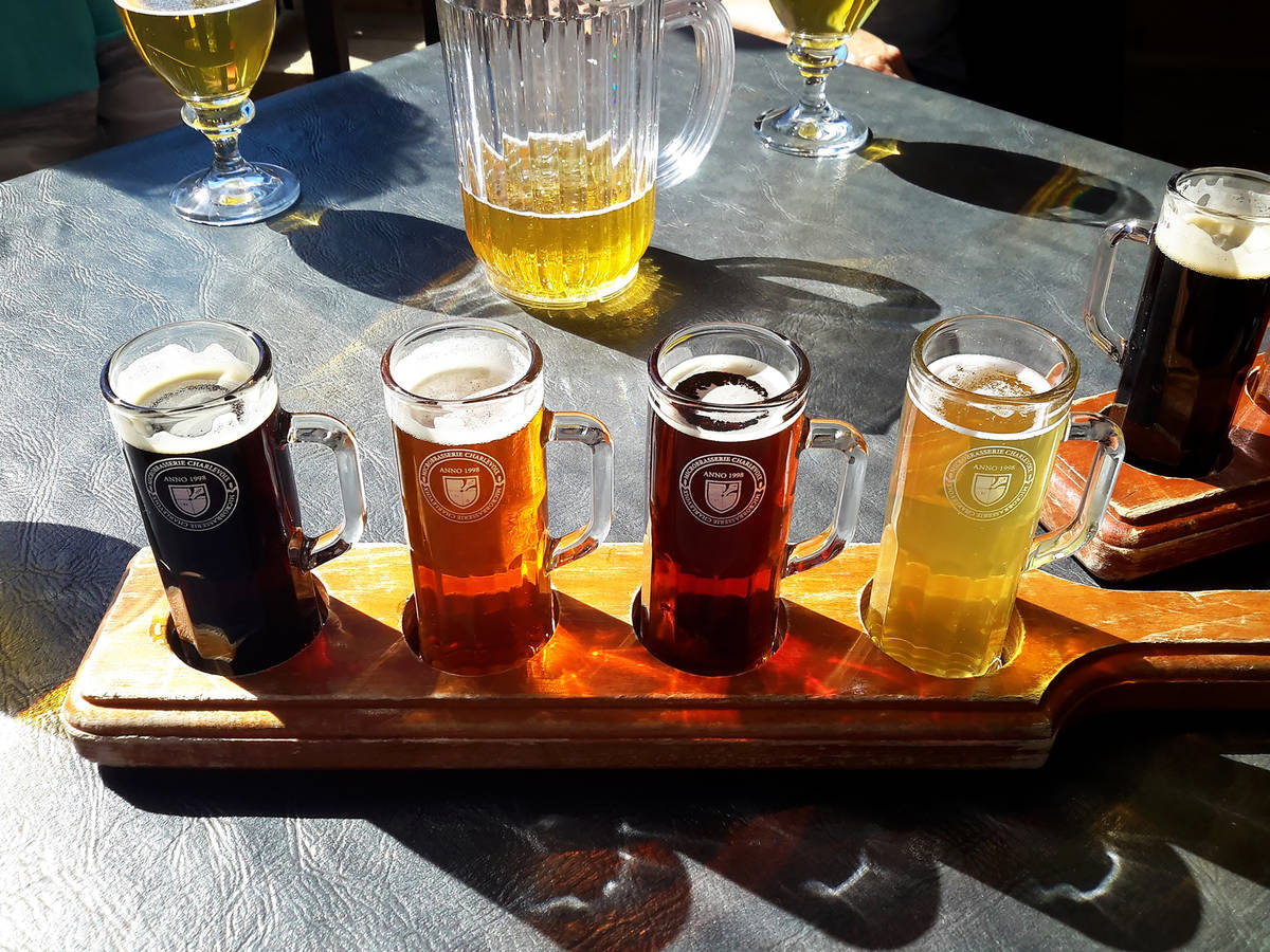 beer flight on a table in the sun
