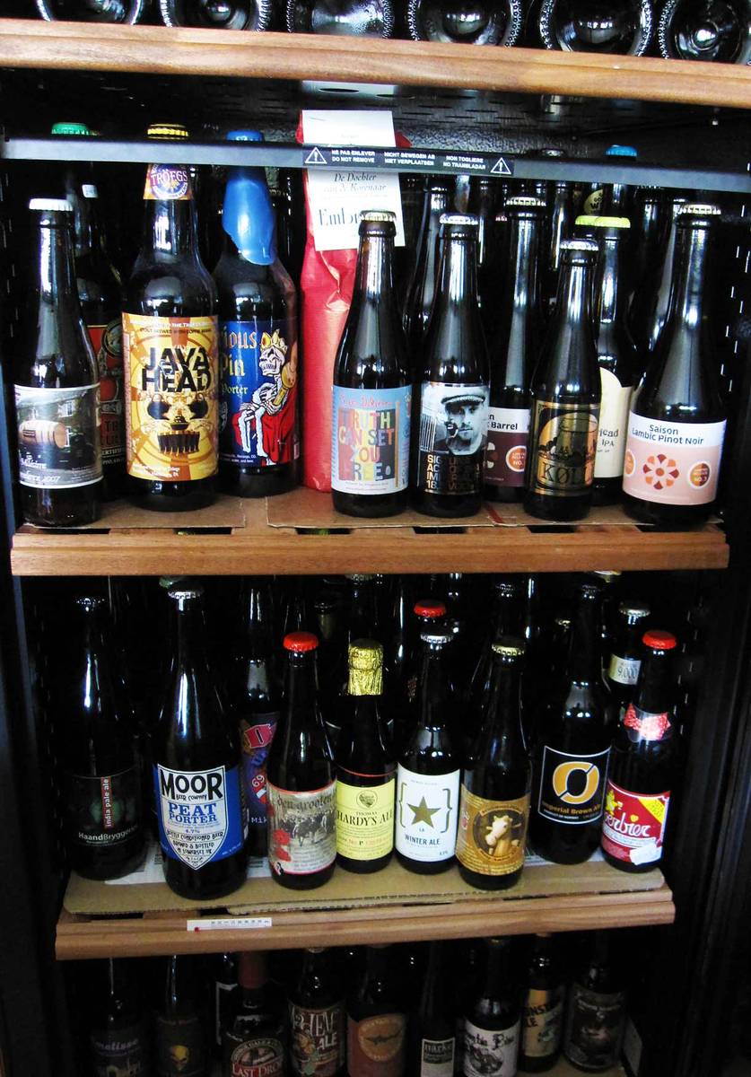 collection of beer on shelves in a beer cellar