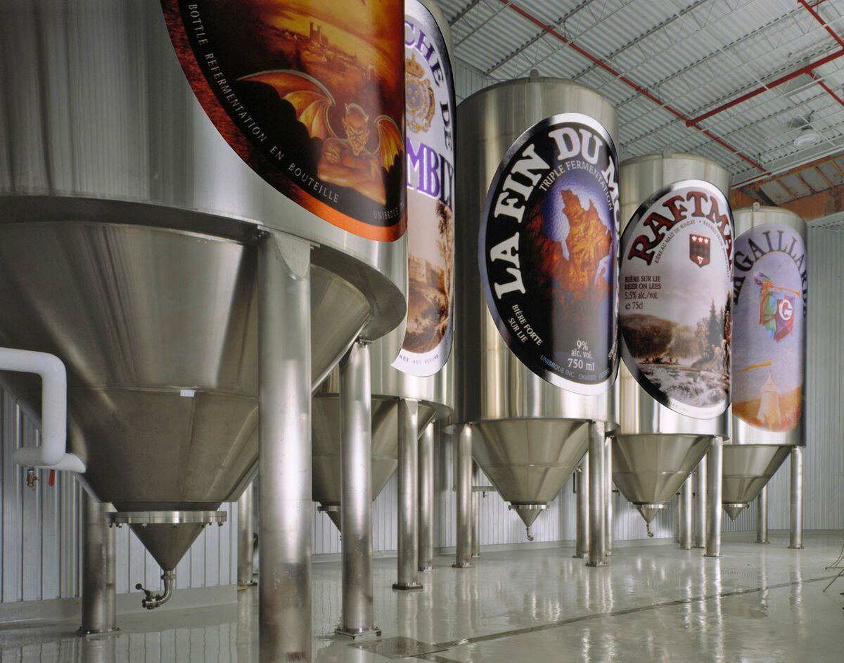 unibroue fermentation tanks with label artwork