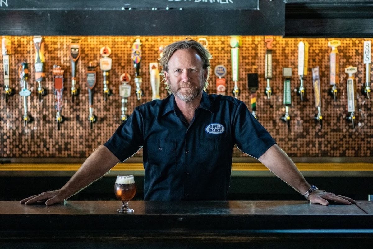 keith schlabs stands behind flying saucer draught emporium bar