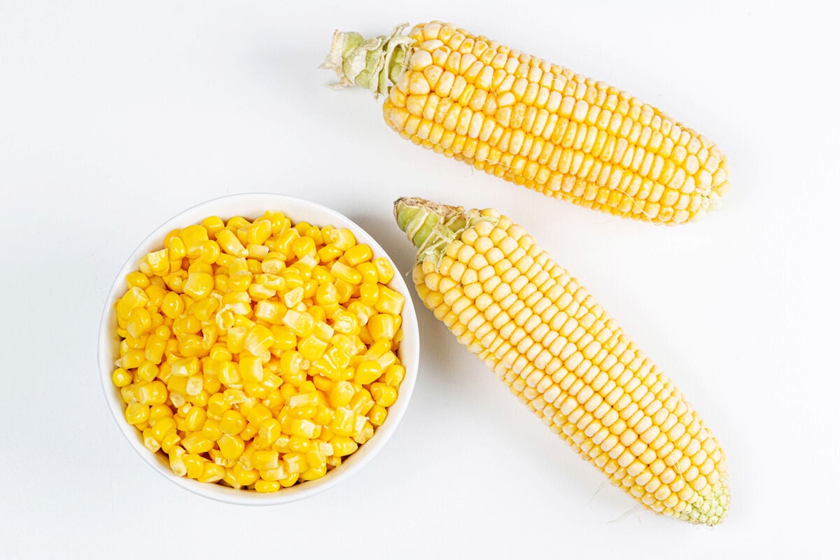 ears of corn, shucked and unshucked